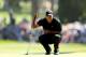SAN FRANCISCO, CA - JUNE 15: Tiger Woods of the United States lines up a putt during the second round of the 112th U.S. Open at The Olympic Club on June 15, 2012 in San Francisco, California. (Photo by Ezra Shaw/Getty Images)