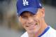 LOS ANGELES - AUGUST 20: WWE Superstar John Cena smiles before throwing out the first pitch before the game between the Chicago Cubs and the Los Angeles Dodgers at Dodger Stadium on August 20, 2009 in Los Angeles, California. (Photo by Harry How/Getty Images)