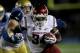PASADENA, CA - OCTOBER 08: Running back Logwone Mitz #34 of the Washington State Cougars dcarries the bqall against the UCLA Bruins at the Rose Bowl on October 8, 2011 in Pasadena, California. (Photo by Stephen Dunn/Getty Images)