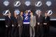 PITTSBURGH, PA - JUNE 22: Slater Koekkoek (C), tenth overall pick by the Tampa Bay Lightning, poses on stage with general manager Steve Yzerman (3rd L) and team representatives during Round One of the 2012 NHL Entry Draft at Consol Energy Center on June 22, 2012 in Pittsburgh, Pennsylvania. (Photo by Bruce Bennett/Getty Images)