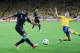 KIEV, UKRAINE - JUNE 15: Theo Walcott of England crosses as Sebastian Larsson of Sweden tries to block it during the UEFA EURO 2012 group D match between Sweden and England at The Olympic Stadium on June 15, 2012 in Kiev, Ukraine. (Photo by Christopher Lee/Getty Images)