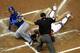 MIAMI, FL - JUNE 23: Edwin Encarnacion #10 (L) of the Toronto Blue Jays scores on a squeeze play against Catcher Brett Hayes #9 of the Miami Marlins in the second inning at Marlins Park on June 23, 2012 in Miami, Florida. (Photo by Marc Serota/Getty Images)