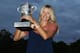 PARIS, FRANCE - JUNE 09: French Open women's champion Maria Sharapova of Russia poses with the Coupe Suzanne Lenglen near the Eiffel Tower after her victory earlier in the day in the women's singles final against Sara Errani of Italy during day 14 of the French Open at Roland Garros on June 9, 2012 in Paris, France. (Photo by Matthew Stockman/Getty Images)