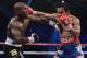 LAS VEGAS, NV - JUNE 09: (L-R) Timothy Bradley and Manny Pacquiao exchange punches during their WBO welterweight title fight at MGM Grand Garden Arena on June 9, 2012 in Las Vegas, Nevada. (Photo by Kevork Djansezian/Getty Images)