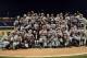 OMAHA, NE - JUNE 25: Arizona Wildcats pose for a team photograph with trophy after a 4-1 win and a 2-0 series sweep of the South Carolina Gamecocks during game 2 of the College World Series at TD Ameritrade Field on June 25, 2012 in Omaha, Nebraska. (Photo by Harry How/Getty Images)