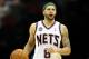 NEWARK, NJ - APRIL 10: Deron Williams #8 of the New Jersey Nets brings the ball up court in the second half against the Philadelphia 76ers at Prudential Center on April 10, 2012 in Newark, New Jersey. NOTE TO USER: User expressly acknowledges and agrees that, by downloading and or using this photograph, User is consenting to the terms and conditions of the Getty Images License Agreement. (Photo by Chris Chambers/Getty Images)