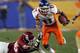 GLENDALE, AZ - JANUARY 01: Wide receiver Drisan James #11 of the Boise State Broncos runs by linebacker Zach Latimer #46 of the Oklahoma Sooners in the second quarter at the Tostito's Fiesta Bowl at University of Phoenix Stadium on January 1, 2007 in Glendale, Arizona. The Broncos defeated the Sooners 43-42 in overtime. (Photo by Lisa Blumenfeld/Getty Images)