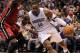 ORLANDO, FL - MARCH 13: Dwight Howard #12 of the Orlando Magic drives to the basket against Joel Anthony #50 of the Miami Heat during the game at Amway Center on March 13, 2012 in Orlando, Florida. NOTE TO USER: User expressly acknowledges and agrees that, by downloading and or using this photograph, User is consenting to the terms and conditions of the Getty Images License Agreement. (Photo by Sam Greenwood/Getty Images)