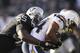 OAKLAND, CA - JANUARY 01: Curtis Brinkley #44 of the San Diego Chargers is tackled by Rolando McClain #55 of the Oakland Raiders at O.co Coliseum on January 1, 2012 in Oakland, California. (Photo by Ezra Shaw/Getty Images)