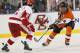 Schultz, Left, Takes on an Opposing Forward