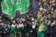 SOUTH BEND, IN - OCTOBER 29: The leprechaun and cheerleaders for the Notre Dame Fighting Irish run onto the field before a game against the Navy Midshipmen at Notre Dame Stadium on October 29, 2011 in South Bend, Indiana. (Photo by Jonathan Daniel/Getty Images)