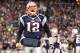 FOXBORO, MA - JANUARY 22: Tom Brady #12 of the New England Patriots celebrates after scoring a touchdown in the fourth quarter against the Baltimore Ravens during their AFC Championship Game at Gillette Stadium on January 22, 2012 in Foxboro, Massachusetts. (Photo by Jim Rogash/Getty Images)