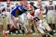 JACKSONVILLE, FL - OCTOBER 29: Jelani Jenkins #3 of the Florida Gators attempts to tackle Aaron Murray #11 of the Georgia Bulldogs during the game at EverBank Field on October 29, 2011 in Jacksonville, Florida. (Photo by Sam Greenwood/Getty Images)