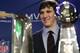 INDIANAPOLIS, IN - FEBRUARY 06: In this General Motors handout, Eli Manning #10 of the New York Giants poses with the Super Bowl Championship Lombardi Trophy (right) and the Pete Rozelle Trophy for being the Super Bowl XLVI Most Valuable Player after defeating the New England Patriots during Super Bowl XLVI on February 6, 2012 in Indianapolis, Indiana. Manning, named MVP, led the Giants to a 21-17 victory. (Photo by AJ Mast/General Motors via Getty Images)