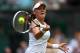 LONDON, ENGLAND - JULY 05: Agnieszka Radwanska of Poland returns a shot during her Ladies' Singles semi final match against Angelique Kerber of Germany on day ten of the Wimbledon Lawn Tennis Championships at the All England Lawn Tennis and Croquet Club on July 5, 2012 in London, England. (Photo by Paul Gilham/Getty Images)
