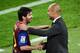 BARCELONA, SPAIN - MAY 05: Lionel Messi of FC Barcelona (R) shakes hands with his Head coach Josep Guardiola of FC Barcelona after scoring his team's third goal during the La Liga match between FC Barcelona and RCD Espanyol at Camp Nou on May 5, 2012 in Barcelona, Spain. This is the last match as head coach of FC Barcelona for Josep Guardiola at the Camp Nou Stadium. (Photo by David Ramos/Getty Images)