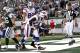EAST RUTHERFORD, NJ - NOVEMBER 27: Steve Johnson #13 of the Buffalo Bills grabs his leg while celebrating after scoring a touchdown during a game against the New York Jets at MetLife Stadium on November 27, 2011 in East Rutherford, New Jersey. The Bills were penalized 15 yards for excessive celebration as Johnson was apparently mimicking the self-inflicted gunshot wound of Plaxico Burress #17 of the New York Jets. (Photo by Jeff Zelevansky/Getty Images)