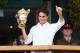 LONDON, ENGLAND - JULY 08: Roger Federer of Switzerland holds up the winner's trophy and gives a thumbs up to the crowd after winning his Gentlemen's Singles final match against Andy Murray of Great Britain on day thirteen of the Wimbledon Lawn Tennis Championships at the All England Lawn Tennis and Croquet Club on July 8, 2012 in London, England. (Photo by Clive Rose/Getty Images)