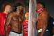 LONDON, ENGLAND - JULY 12: David Haye (left) and Dereck Chisora eyeball each other as Haye's trainer Adam Booth (centre) looks on during the Weigh-In at The Odeon Leicester Square on July 12, 2012 in London, England. (Photo by Andrew Redington/Getty Images)