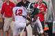 EAST LANSING, MI - SEPTEMBER 02: Johnny Adams #5 of the Michigan State Spartans puts a shoulder hit on Kurt Hess #12 of the Youngstown State Penguins during an NCAA football game at Spartan Stadium on September 2, 2011 in East Lansing, Michigan. The Spartans won 28-6 (Photo by Dave Reginek/Getty Images)