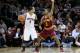 CLEVELAND, OH - DECEMBER 26: Jerryd Bayless #5 of the Toronto Raptors handles the ball against Ramon Sessions #3 of the Cleveland Cavaliers during the season opener at Quicken Loans Arena on December 26, 2011 in Cleveland, Ohio. NOTE TO USER: User expressly acknowledges and agrees that, by downloading and or using this photograph, User is consenting to the terms and conditions of the Getty Images License Agreement. (Photo by Mike Lawrie/Getty Images)
