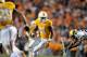 Nov 19, 2011; Knoxville,TN, USA; Tennessee Volunteers wide receiver Da'Rick Rogers (21) rushes against Vanderbilt Commodores defensive back Eric Samuels (22) during the second half at Neyland Stadium. Tennessee defeated Vanderbilt 27-21 in overtime. Mandatory Credit: Jim Brown-US PRESSWIRE