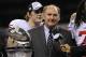 Dec 3, 2011; Indianapolis, IN, USA; Big Ten commissioner James Delany presents the championship trophy to the Wisconsin Badgers after the game against the Michigan State Spartans at the Lucas Oil Stadium. The Badgers defeated the Spartans 42-39. Mandatory Credit: Richard Mackson-US PRESSWIRE