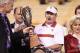 TEMPE, AZ - DECEMBER 30: Head coach Bob Stoops of the Oklahoma Sooners is presented the Insight Bowl trophy after defeating the Iowa Hawkeyes at Sun Devil Stadium on December 30, 2011 in Tempe, Arizona. The Sooners defeated the Hawkeyes 31-14. (Photo by Christian Petersen/Getty Images)