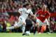 MANCHESTER, ENGLAND - MAY 06: Joe Allen of Swansea City competes with Paul Scholes of Manchester United during the Barclays Premier League match between Manchester United and Swansea City at Old Trafford on 6 May 2012 in Manchester, England. (Photo by Laurence Griffiths/Getty Images)