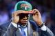 June 28, 2012; Newark, NJ, USA; John Henson (North Carolina) puts on a cap after being introduced as the number fourteen overall pick to the Milwaukee Bucks during the 2012 NBA Draft at the Prudential Center. Mandatory Credit: Jerry Lai-US PRESSWIRE