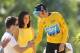 PARIS, FRANCE - JULY 22: Bradley Wiggins of Great Britain and SKY Procyling inadvertadly shakes hands with a podium invader after the twentieth and final stage of the 2012 Tour de France, from Rambouillet to the Champs-Elysees on July 22, 2012 in Paris, France. (Photo by Bryn Lennon/Getty Images)