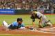 ST. PETERSBURG, FL - MAY 6: Outfielder Desmond Jennings #8 of the Tampa Bay Rays slides into home plate for a run against the Oakland Athletics May 6, 2012 at Tropicana Field in St. Petersburg, Florida. The Rays scored 4 runs on 2 hits in the inning. (Photo by Al Messerschmidt/Getty Images)