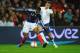 LONDON, ENGLAND - NOVEMBER 17: Yann M'Vila (L) of France holds off the challenge of Jordan Henderson (R) of England during the international friendly match between England and France at Wembley Stadium on November 17, 2010 in London, England. (Photo by Laurence Griffiths/Getty Images)