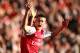 LONDON, ENGLAND - FEBRUARY 26: Laurent Koscielny of Arsenal celebrates a goal scored by Theo Walcott during the Barclays Premier League match between Arsenal and Tottenham Hotspur at Emirates Stadium on February 26, 2012 in London, England. (Photo by Clive Mason/Getty Images)