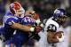 December 21, 2011; San Diego, CA, USA; TCU Horned Frogs running back Ed Wesley (34) fights for extra yardage while being chased by Louisiana Tech Bulldogs defensive end Matt Broha (91) and linebacker Adrien Cole (44) during the second quarter in the Poinsettia Bowl at Qualcomm Stadium. Mandatory Credit: Christopher Hanewinckel-US PRESSWIRE