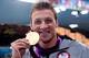 LONDON, ENGLAND - JULY 28: Ryan Lochte of the United States celebrates with his Gold Medal during the Medal Ceremony for the Men's 400m Individual Medley on Day 1 of the London 2012 Olympic Games at the Aquatics Centre on July 28, 2012 in London, England. (Photo by Adam Pretty/Getty Images)