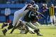 CHARLOTTE, NC - DECEMBER 11: Quarterback Cam Newton #1 of the Carolina Panthers is tackled by Michael Palmer #81 of the Atlanta Falcons at Bank of America Stadium on December 11, 2011 in Charlotte, North Carolina. (Photo by Jared C. Tilton/Getty Images)