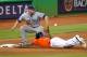 MIAMI, FL - JULY 29: Jose Reyes #7 of the Miami Marlins slides safely into third before the tag of Chase Headley #7 of the San Diego Padres during a game at Marlins Park on July 29, 2012 in Miami, Florida. The Miami Marlins defeated the San Diego Padres 5-4. (Photo by Sarah Glenn/Getty Images)