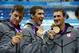 Jul 31, 2012; London, United Kingdom; USA relay team members Conor Dwyer , Michael Phelps and Ryan Lochte hold their gold medals after winning the men's 4x200m freestyle relay finals during the London 2012 Olympic Games at Aquatics Centre. Mandatory Credit: Rob Schumacher-USA TODAY Sports
