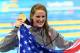 LONDON, ENGLAND - JULY 30: Missy Franklin of the United States celebrates with her gold medal and an American flag during the medal ceremony for the Women's 100m Backstroke on Day 3 of the London 2012 Olympic Games at the Aquatics Centre on July 30, 2012 in London, England. (Photo by Al Bello/Getty Images)