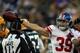 GREEN BAY, WI - JANUARY 15: Tyler Sash #39 of the New York Giants celebrates against the Green Bay Packers during their NFC Divisional playoff game at Lambeau Field on January 15, 2012 in Green Bay, Wisconsin. (Photo by Jonathan Daniel/Getty Images)