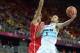 Aug 2, 2012; London, United Kingdom; Argentina guard Emmanuel Ginobili (5) is defended by Tunisia forward Saleh Mejri (15) during the London 2012 Olympic Games at Basketball Arena. Mandatory Credit: Kirby Lee-USA TODAY Sports