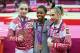 LONDON, ENGLAND - AUGUST 02: Bronze medalist Aliya Mustafina of Russia, gold medalist Gabrielle Douglas of the United States and silver medalist Victoria Komova of Russia pose after the medal ceremony in the Artistic Gymnastics Women's Individual All-Around final on Day 6 of the London 2012 Olympic Games at North Greenwich Arena on August 2, 2012 in London, England. (Photo by Streeter Lecka/Getty Images)
