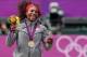 LONDON, ENGLAND - AUGUST 04: Gold medalist Serena Williams of the United States poses on the podium during the medal ceremony for the gold medal match of the Women's Singles Tennis on Day 8 of the London 2012 Olympic Games at the All England Lawn Tennis and Croquet Club on August 4, 2012 in London, England. (Photo by Clive Brunskill/Getty Images)