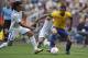 NEWCASTLE, UNITED KINGDOM - AUGUST 4: Roger Espinoza of Honduras and Sandro of Brazil battle for the ball during the Men's Football Quarter Final match between Brazil and Honduras, on Day 8 of the London 2012 Olympic Games at St James' Park on August 4, 2012 in Newcastle, England. (Photo by Francis Bompard/Getty Images)