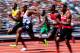 LONDON, ENGLAND - AUGUST 04: (L-R) Usain Bolt of Jamaica and James Dasaolu of Great Britain compete in the Men's 100m Round 1 Heats on Day 8 of the London 2012 Olympic Games at Olympic Stadium on August 4, 2012 in London, England. (Photo by Stu Forster/Getty Images)