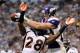 MINNEAPOLIS, MN - DECEMBER 4: Kyle Rudolph #82 of the Minnesota Vikings catches the ball over Quinton Carter #28 of the Denver Broncos for a touchdown in the second quarter on December 4, 2011 at Mall of America Field at the Hubert H. Humphrey Metrodome in Minneapolis, Minnesota. (Photo by Hannah Foslien/Getty Images)