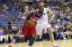 Mar 15, 2012; New Orleans, LA, USA; Washington Wizards forward Andray Blatche (7) drives the ball toward the basket in front of New Orleans Hornets forward Gustavo Ayon (15) during the second quarter at the New Orleans Arena. Mandatory Credit: Crystal LoGiudice-US PRESSWIRE