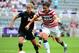 Aug 3, 2012; Newcastle, United Kingdom; USA forward Abby Wambach (14) works against New Zealand defender Rebecca Smith (6) in the second half of the women's quarterfinal match during the London 2012 Olympic Games at St James' Park. Mandatory Credit: Christopher Hanewinckel-USA TODAY Sports