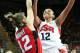 LONDON, ENGLAND - AUGUST 07: Diana Taurasi #12 of United States drives to the basket against Lizanne Murphy #12 of Canada during the Women's Basketball quaterfinal on Day 11 of the London 2012 Olympic Games at the Basketball Arena on August 7, 2012 in London, England. (Photo by Christian Petersen/Getty Images)
